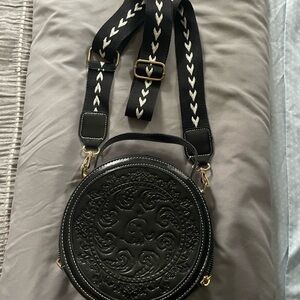 Black Embossed Round Crossbody Bag